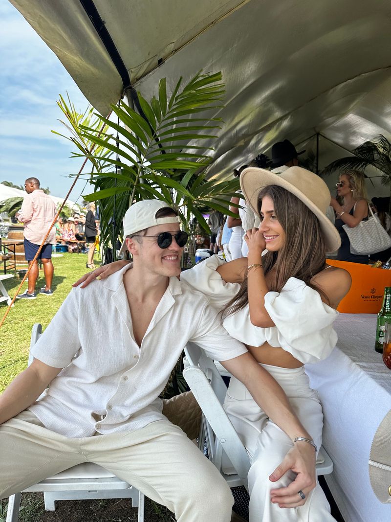 Kyra and Dustin in white at a summer garden event